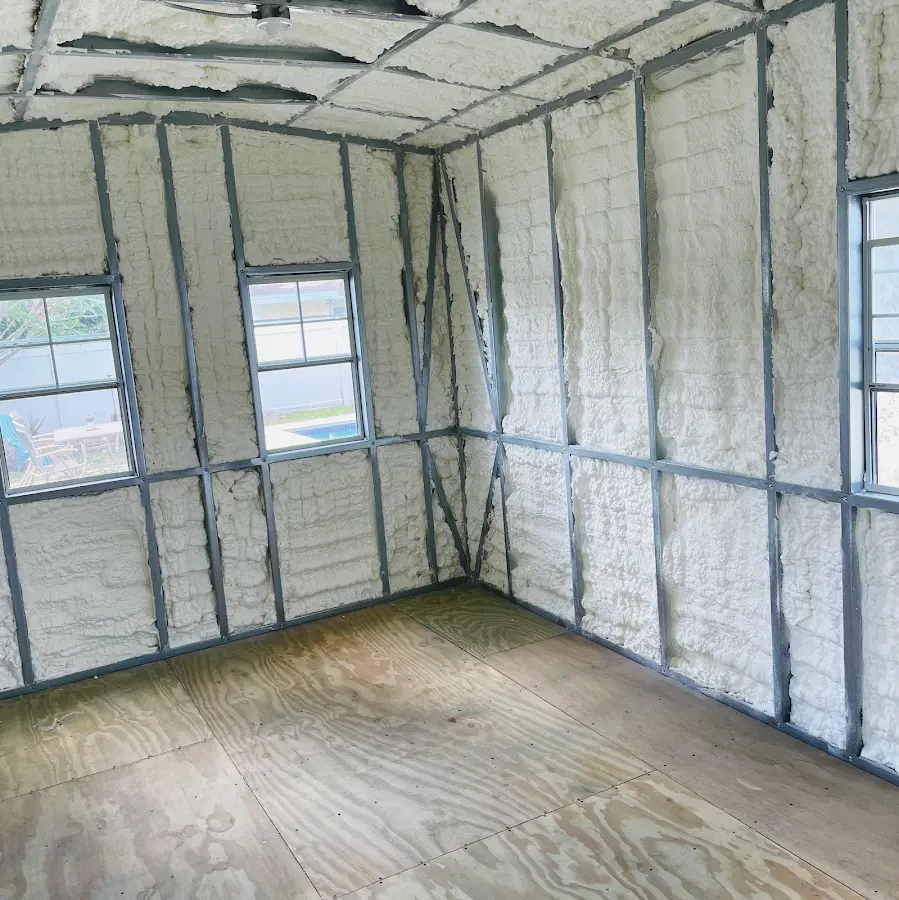 Closed-cell spray foam insulation applied to wall cavities in a residential project in New Hyde Park